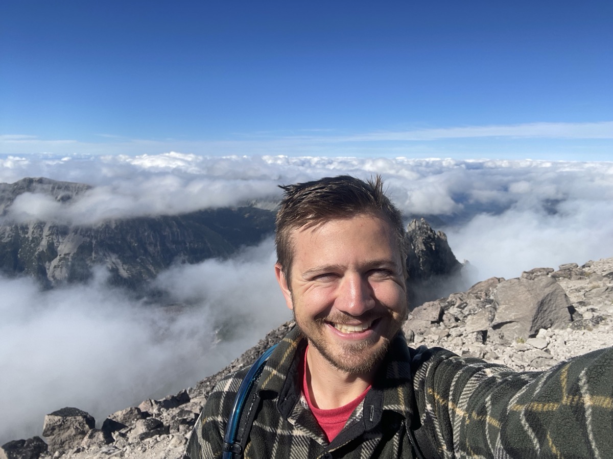 Erik hiking above the clouds